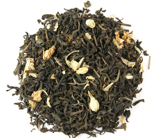 Green loose leaf tea with white jasmine flowers. A lovely jasmine green tea to brew.