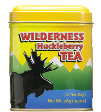 Load image into Gallery viewer, Yellow metal box with a black moose in blue water in front of green mountains with white peaks. Container contains 12 tea bags of Wilderness Huckleberry tea.
